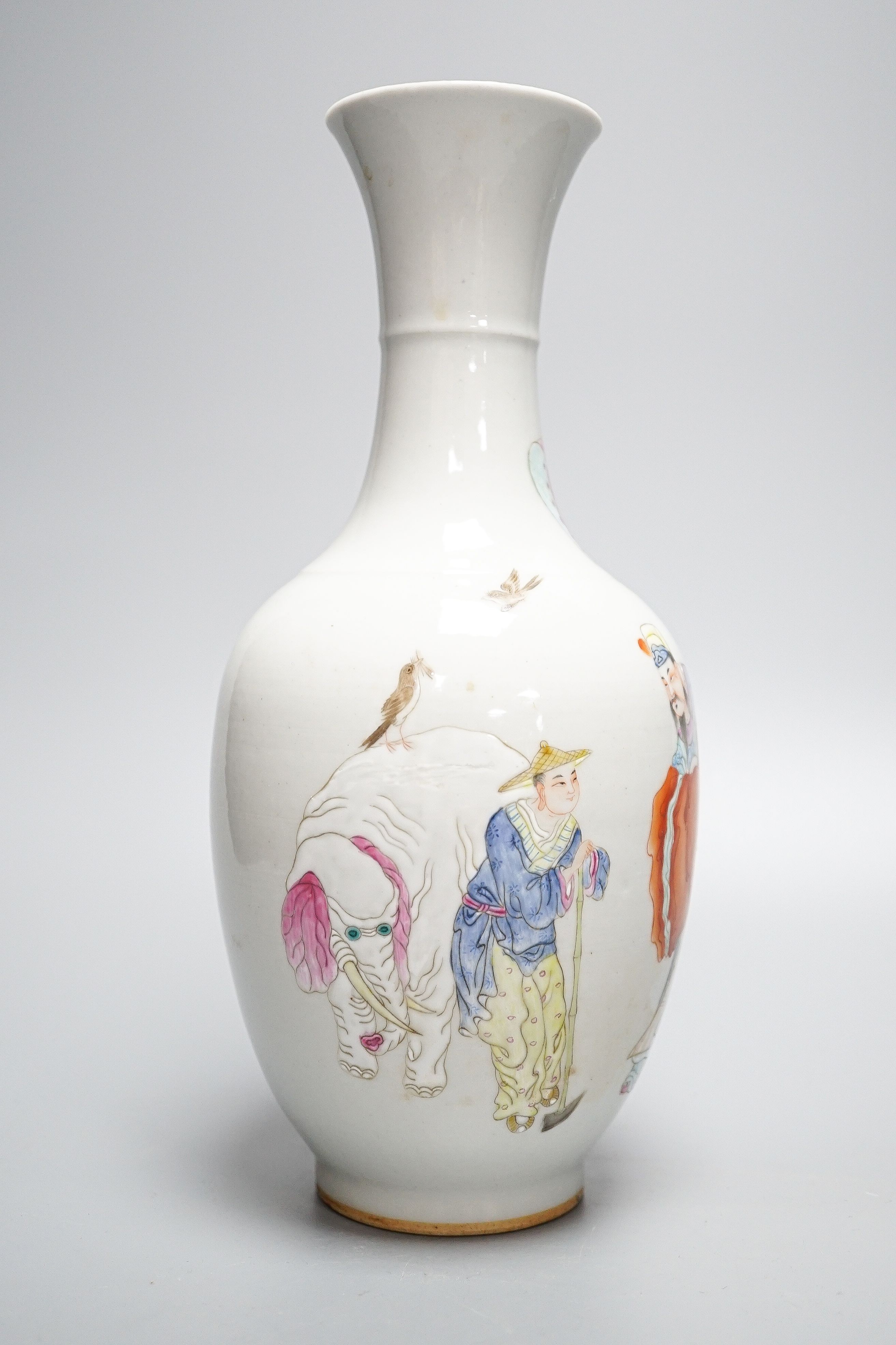 A Chinese porcelain vase, painted with figures and elephant in famille rose enamels, 25cm